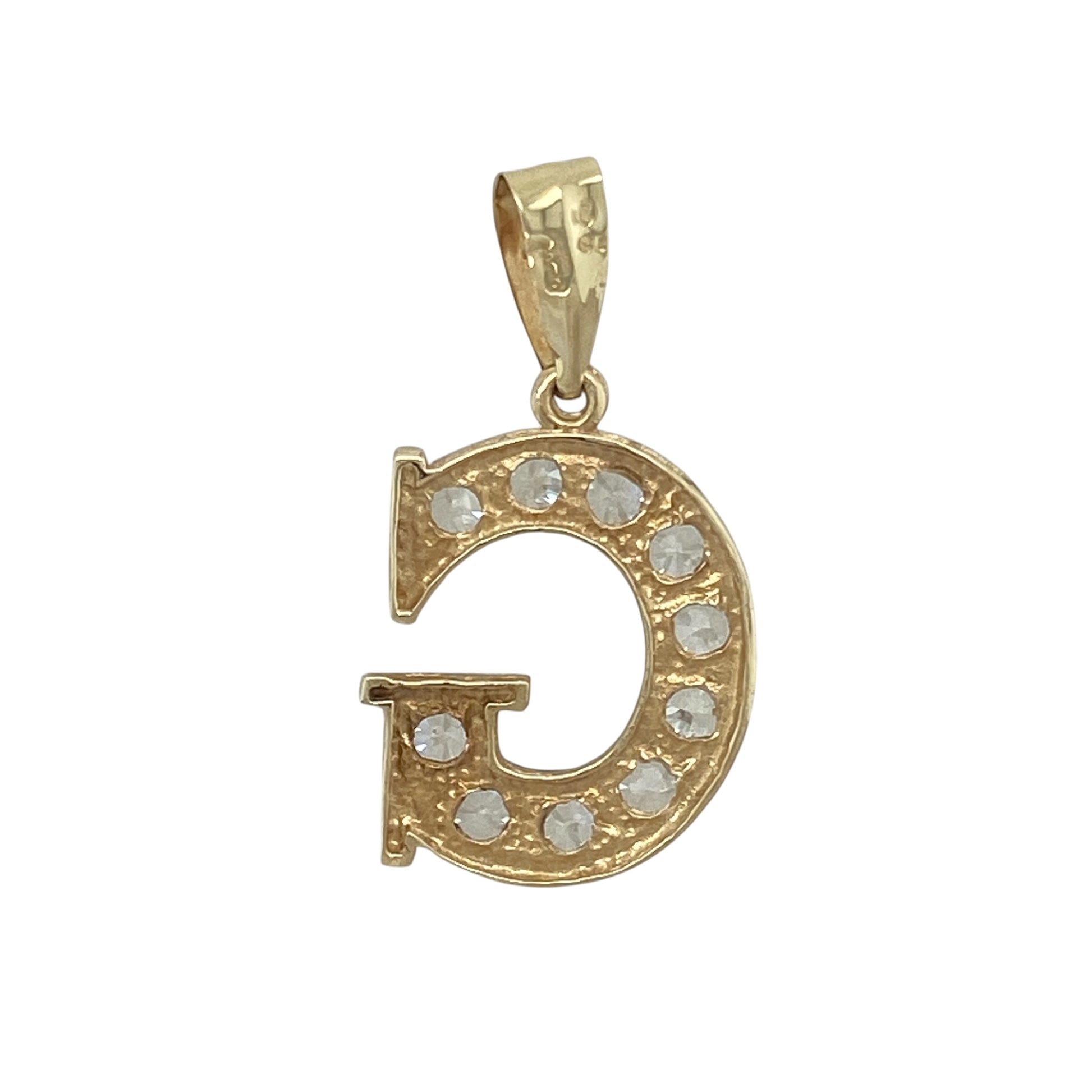 Add a personal touch of sparkle to your collection with this pre-owned 9ct yellow and white gold cubic zirconia set ‘G’ initial pendant—an eye-catching and meaningful piece with modern appeal.

Design: The pendant features a bold ‘G’ initial design, accented with sparkling cubic zirconia that create a bright and stylish finish.
Material: Made from 9-carat yellow and white gold, the two-tone finish enhances the shape of the letter while complementing the brilliance of the stones.