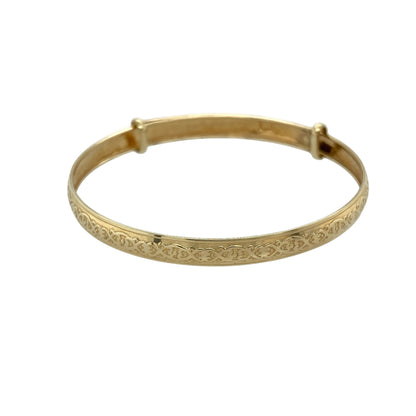 Add a meaningful and traditional touch to your collection with this pre-owned 9ct yellow gold Celtic patterned expanding baby bangle—an elegant piece designed with both style and practicality in mind.

Design: The bangle features a 4mm wide band with intricate Celtic patterned detailing, symbolising eternity and connection, with an expanding design for ease of wear.