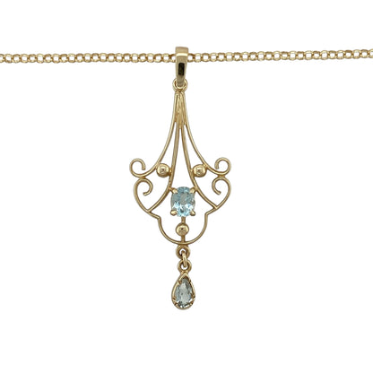 Add vintage-inspired elegance and a touch of colour to your collection with this pre-owned 9ct yellow gold blue topaz set fancy pendant on a belcher chain necklace—an eye-catching piece with timeless appeal.

Design: The necklace features a decorative vintage-style pendant measuring approximately 4.5cm in length including the bail, set with a blue topaz gemstone that adds a soft and refreshing pop of colour.