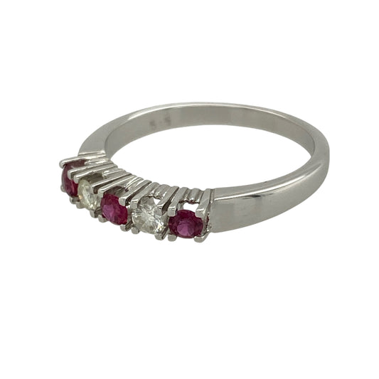 Add refined elegance and rich colour to your collection with this pre-owned 14ct white gold diamond and ruby set band ring—an effortlessly stylish piece with timeless appeal.

Design: The ring features three round rubies, each approximately 2.5mm in diameter, complemented by two brilliant-cut diamonds totalling approximately 0.20ct, creating a balanced and eye-catching arrangement.