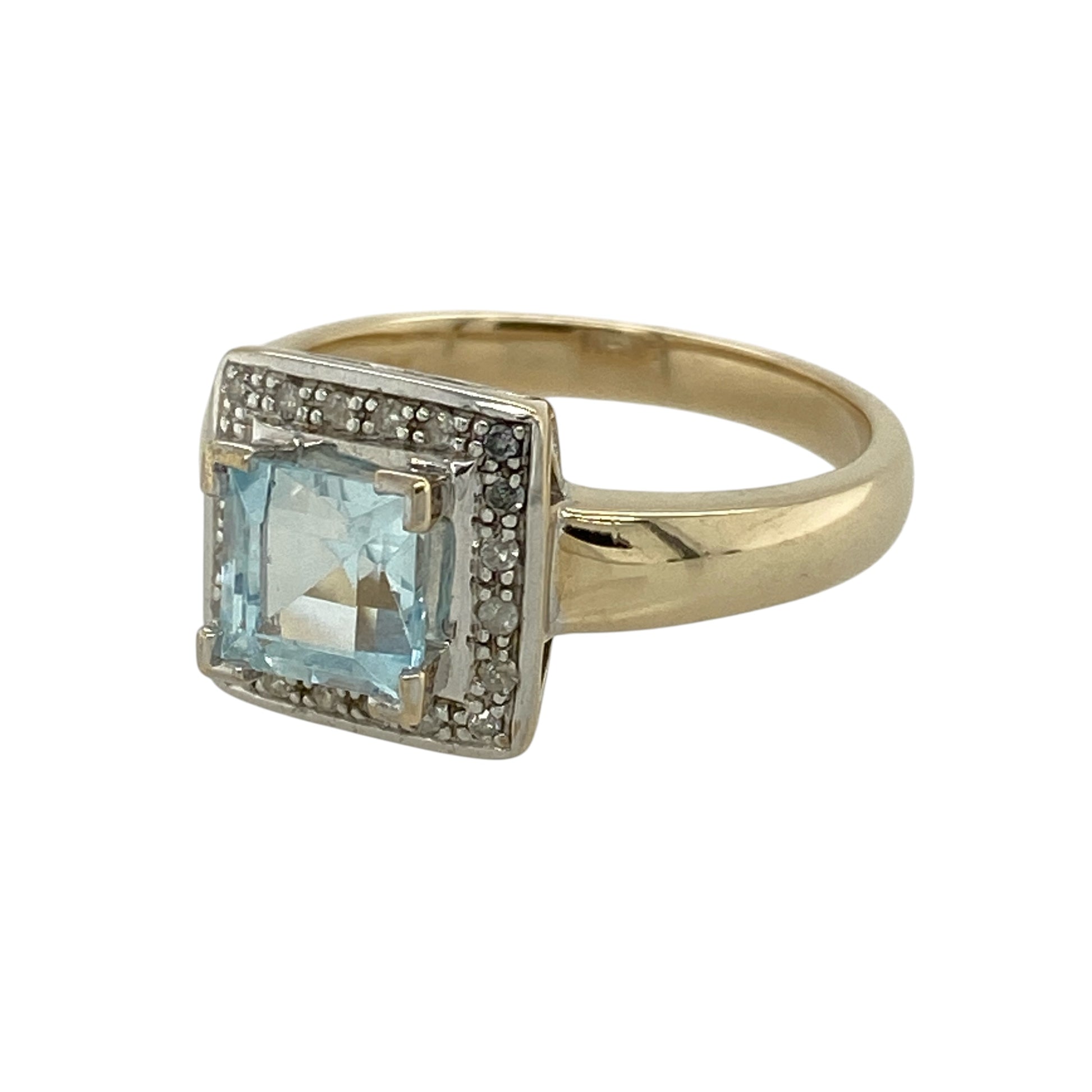 Add refined sparkle and serene colour to your collection with this pre-owned 9ct yellow gold diamond and aquamarine set square halo ring—an elegant piece with timeless appeal.

Design: The ring features a 6mm by 6mm square aquamarine centre stone, surrounded by a halo of small diamonds that enhance its soft blue tone and create a bright, eye-catching finish.
