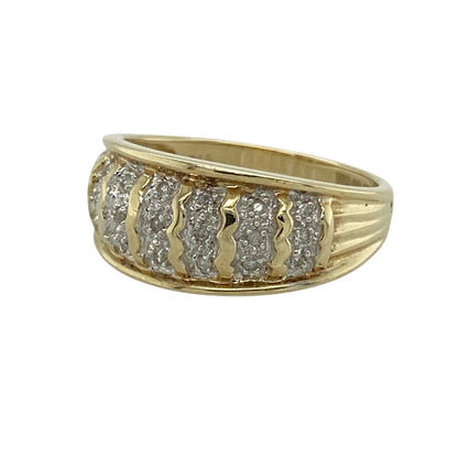 Add bold sparkle and timeless style to your collection with this pre-owned 9ct yellow gold diamond set band ring—an eye-catching piece with a strong and elegant presence.

Design: The ring features a wide band front measuring approximately 9mm, set with sparkling diamonds that create a bright and striking finish across the surface.
Material: Made from 9-carat yellow gold, the polished finish enhances the warmth of the metal while complementing the brilliance of the diamonds.