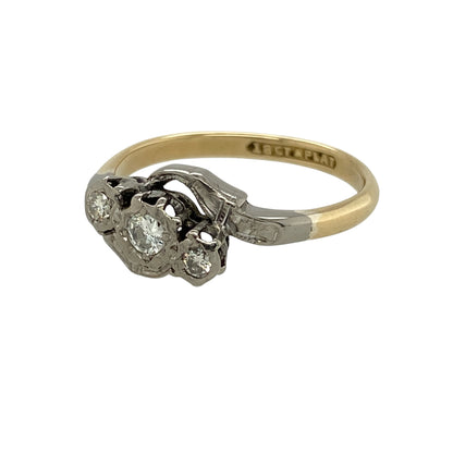 Add refined elegance and mixed-metal luxury to your collection with this pre-owned 18ct yellow gold and platinum diamond set twist trilogy ring—an eye-catching piece with timeless appeal.

Design: The ring features a twist trilogy design with a front measuring approximately 9mm in height, set with sparkling diamonds arranged in a flowing formation that creates movement and brilliance.