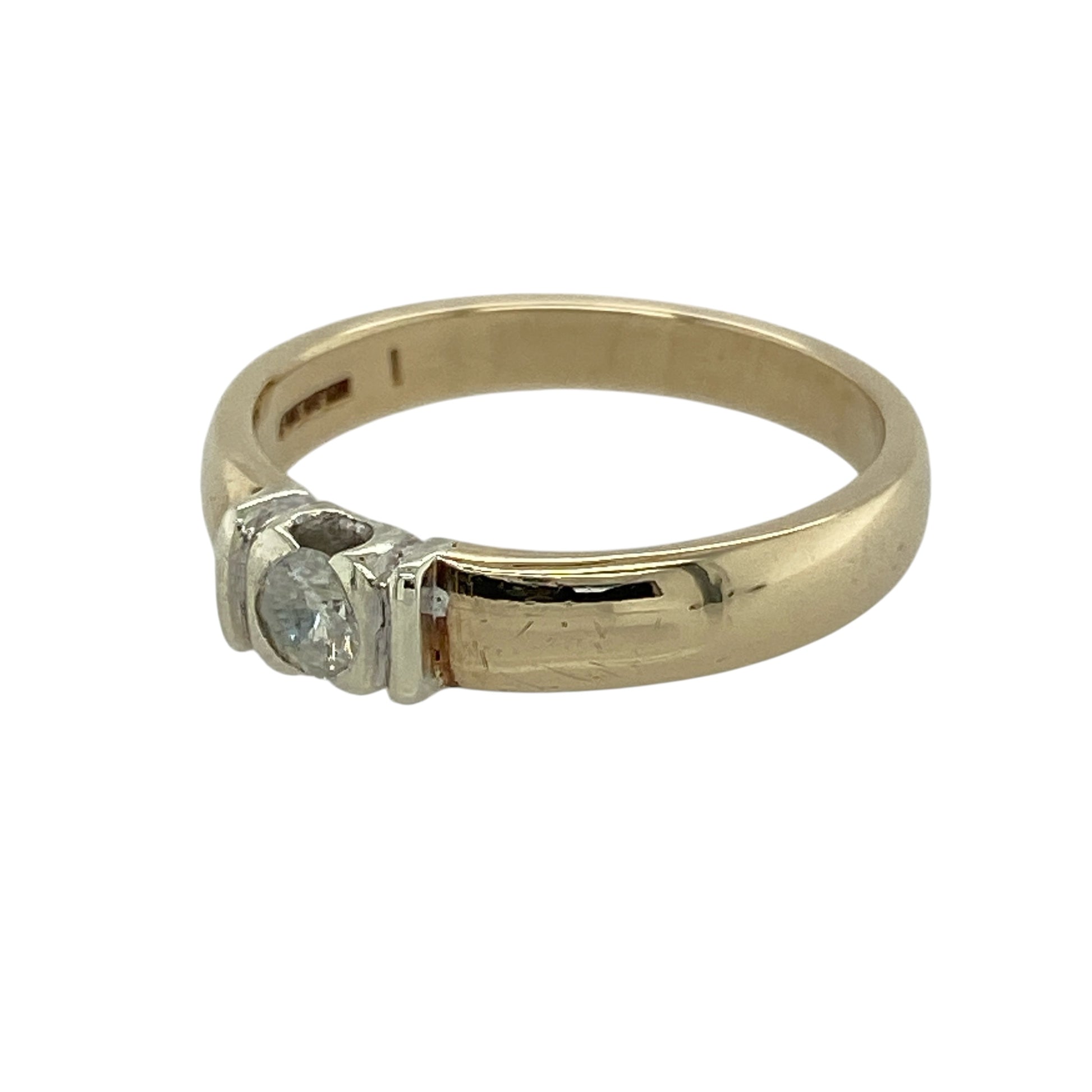 Add timeless elegance and understated sparkle to your collection with this pre-owned 9ct yellow gold diamond set solitaire band ring—an effortlessly stylish piece with classic appeal.

Design: The ring features a single brilliant-cut diamond of approximately 0.20ct, set into the band to create a clean and refined focal point.
Material: Made from 9-carat yellow gold, the polished finish enhances the warmth of the metal while complementing the brilliance of the diamond.