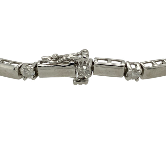 Add refined brilliance and timeless elegance to your collection with this pre-owned 9ct white gold diamond set bracelet—an eye-catching piece designed to impress.

Design: The bracelet features nineteen brilliant-cut diamonds set in a linear arrangement, separated by sleek white gold bars that create a clean, structured, and contemporary look. With approximately 0.76ct total diamond content, it offers beautiful, continuous sparkle.