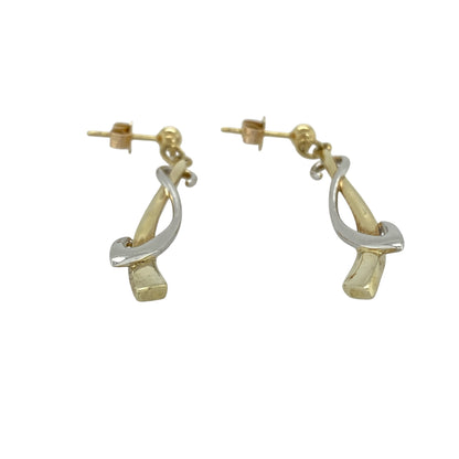 Add elegant movement and contemporary texture to your collection with these pre-owned 9ct yellow and white gold weave drop earrings—an eye-catching pair with timeless appeal.

Design: The earrings feature a woven drop design, intertwining yellow and white gold strands to create a flowing, textured look that catches the light beautifully.
Material: Made from 9-carat yellow and white gold, the two-tone finish enhances the woven pattern while adding contrast and versatility.