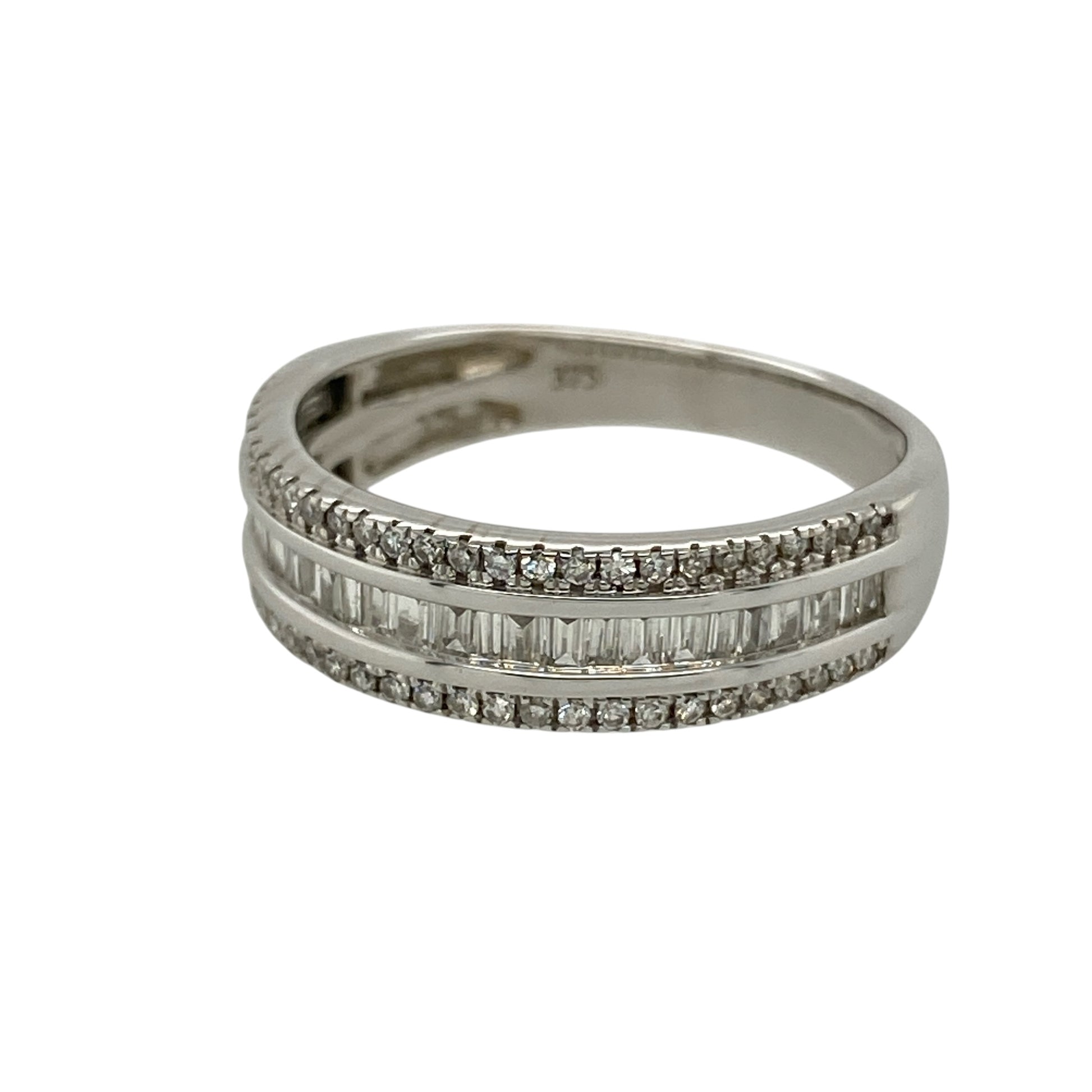 Add bold sparkle and contemporary elegance to your collection with this pre-owned 9ct white gold diamond set three row band ring—an eye-catching piece with refined detail.

Design: The ring features a 6mm wide front composed of three rows of diamonds, with baguette-cut diamonds forming the centre row and smaller brilliant-cut diamonds set above and below, creating a structured and multi-dimensional look.