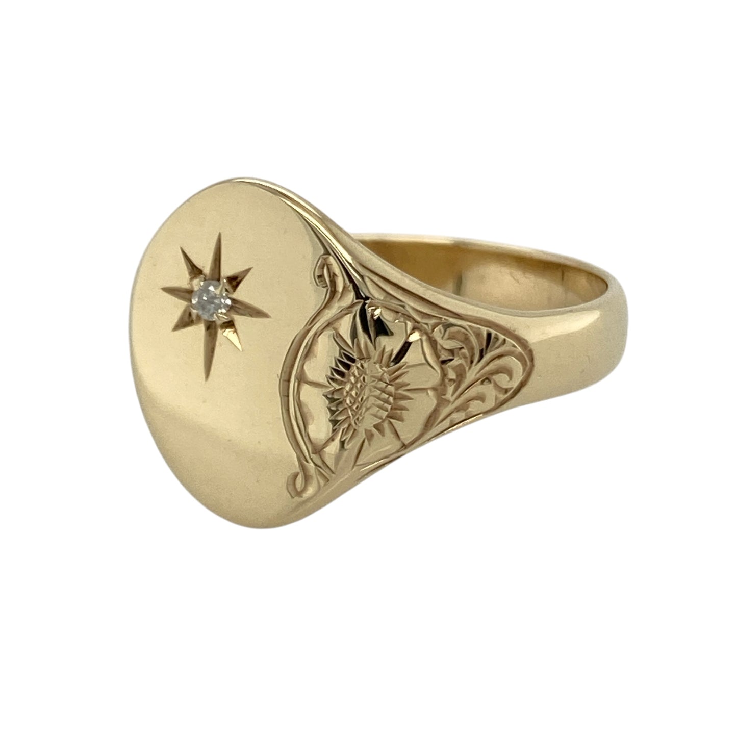 Make a bold and distinctive statement with this pre-owned 9ct yellow gold diamond set patterned oval signet ring—an eye-catching piece with classic appeal.

Design: The ring features a 15mm high oval signet face, set with a single diamond for a subtle touch of sparkle, with patterned detailing on one side adding texture and visual interest.
Material: Made from 9-carat yellow gold, the polished and patterned finish enhances the warm tone of the metal while highlighting the unique design elements.