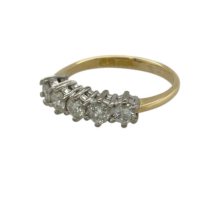 Add timeless brilliance and elegant sparkle to your collection with this pre-owned 18ct yellow gold diamond set five stone band ring—an eye-catching piece with classic appeal.

Design: The ring features five diamonds arranged across the band, creating a balanced and continuous display of sparkle, with approximately 0.55ct total diamond content for impressive brilliance.