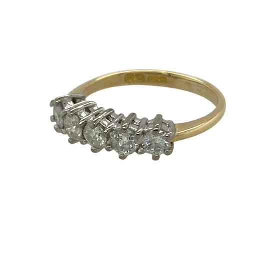 Add timeless brilliance and elegant sparkle to your collection with this pre-owned 18ct yellow gold diamond set five stone band ring—an eye-catching piece with classic appeal.

Design: The ring features five diamonds arranged across the band, creating a balanced and continuous display of sparkle, with approximately 0.55ct total diamond content for impressive brilliance.