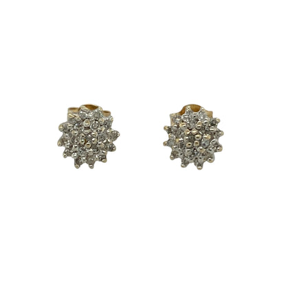 Add classic sparkle and everyday elegance to your collection with these pre-owned 9ct yellow gold diamond set cluster stud earrings—an effortlessly stylish pair with timeless appeal.

Design: The earrings feature a cluster arrangement of sparkling diamonds, creating the illusion of a larger centrepiece while maximising brilliance and shine.
Material: Made from 9-carat yellow gold, the polished finish enhances the warm tone of the metal while complementing the sparkle of the diamonds.