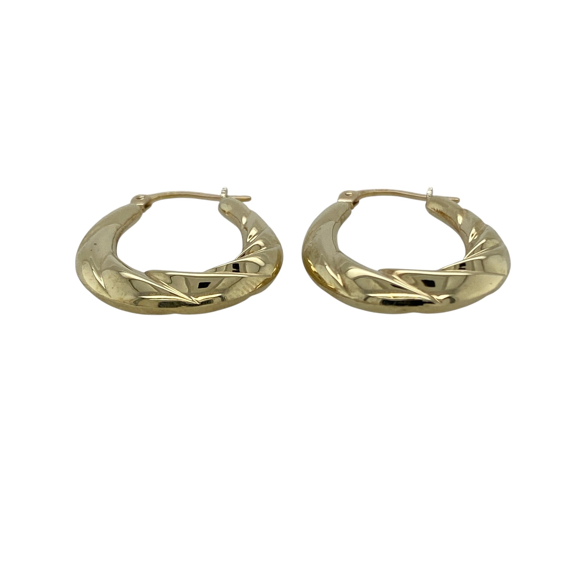 Bring timeless style with a contemporary twist to your collection with these pre-owned 9ct yellow gold twisted oval creole earrings, offering elegant shape and subtle texture—perfect for everyday wear or effortless styling.

Design: The earrings feature an oval creole shape with a twisted design, adding dimension and visual interest while maintaining a classic hoop-inspired look.