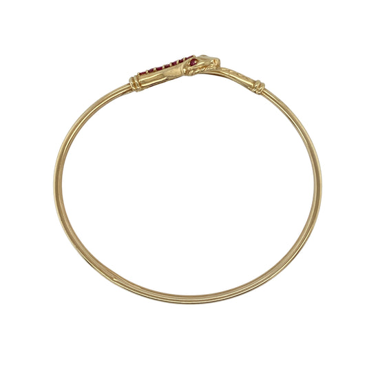 Bring striking style and symbolic elegance to your collection with this pre-owned 9ct yellow gold ruby set snake bangle, featuring a distinctive design with a touch of colour—perfect for making a statement on any occasion.

Design: The bangle features a classic snake design, wrapping elegantly around the wrist with subtle detailing and ruby accents that add a rich pop of colour and visual interest.