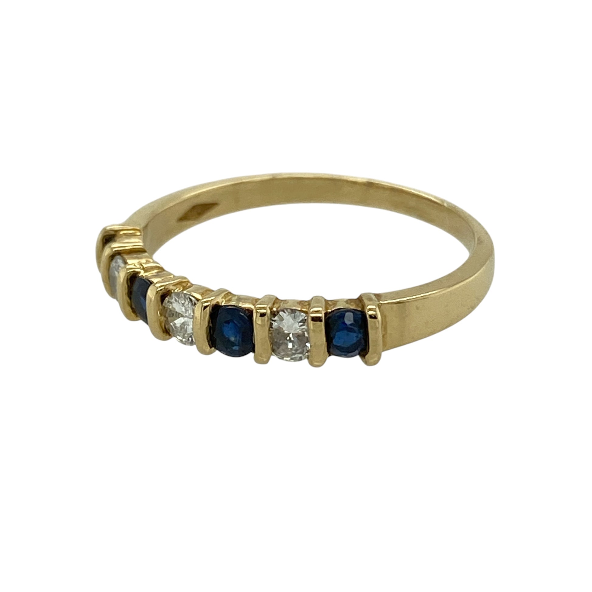 Bring refined sparkle and classic colour to your collection with this pre-owned 18ct yellow gold diamond and sapphire set band ring, featuring a slim profile and timeless appeal—perfect for everyday wear or elegant stacking.

Design: The ring features a band style with a front width of approximately 3mm, set with alternating sapphires and diamonds for a balanced and sophisticated look.