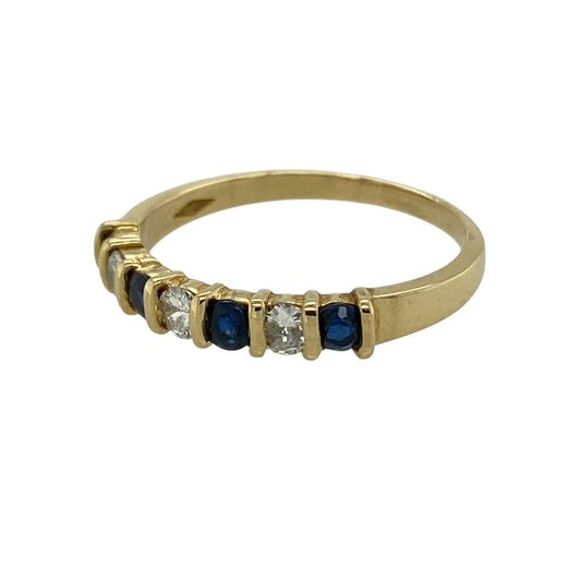 Bring refined sparkle and classic colour to your collection with this pre-owned 18ct yellow gold diamond and sapphire set band ring, featuring a slim profile and timeless appeal—perfect for everyday wear or elegant stacking.

Design: The ring features a band style with a front width of approximately 3mm, set with alternating sapphires and diamonds for a balanced and sophisticated look.