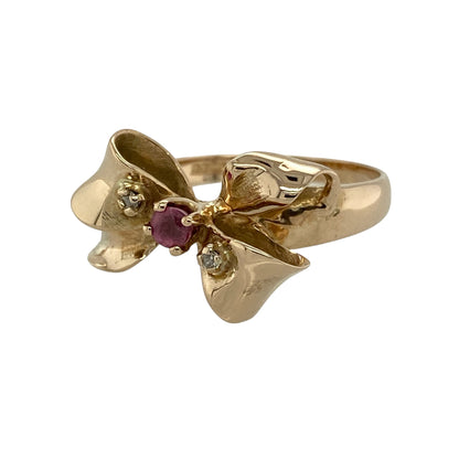 Bring playful elegance and classic sparkle to your collection with this pre-owned 14ct yellow gold diamond and ruby set bow ring, featuring a charming design with vibrant colour—perfect for adding a unique touch to any look.

Design: The ring showcases a bow-shaped front measuring approximately 13mm in height, set with rich red rubies and sparkling diamonds to create a detailed and eye-catching finish.