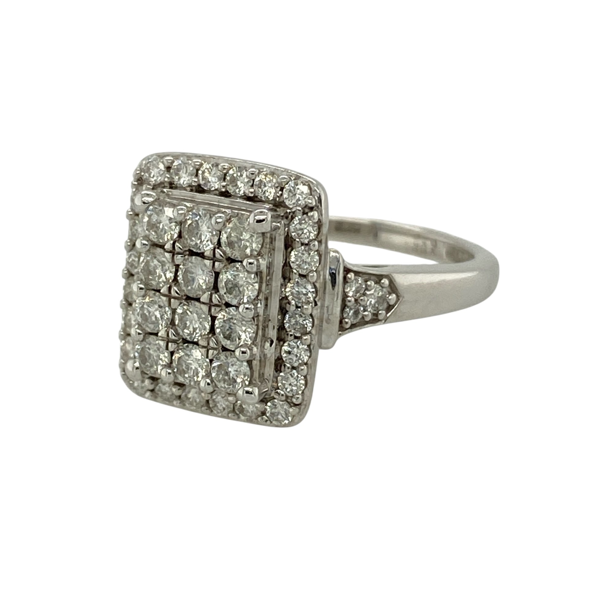 Bring bold brilliance and contemporary elegance to your collection with this pre-owned 9ct white gold diamond rectangle cluster ring, featuring a striking elongated design and impressive sparkle—perfect for special occasions or statement wear.

Design: The ring showcases a rectangular cluster front measuring approximately 14mm in height, set with multiple diamonds to create a dazzling, full-surface effect with strong visual impact.