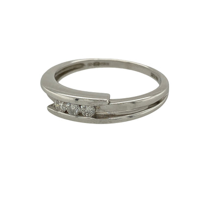 Bring modern elegance and refined sparkle to your collection with this pre-owned 18ct white gold diamond three stone wrap over band ring, featuring a contemporary design with timeless appeal—perfect for everyday wear or special occasions.

Design: The ring features a wrap over band style with three diamonds set across the front, measuring approximately 4mm in width, creating a sleek and balanced look with gentle movement in the design.