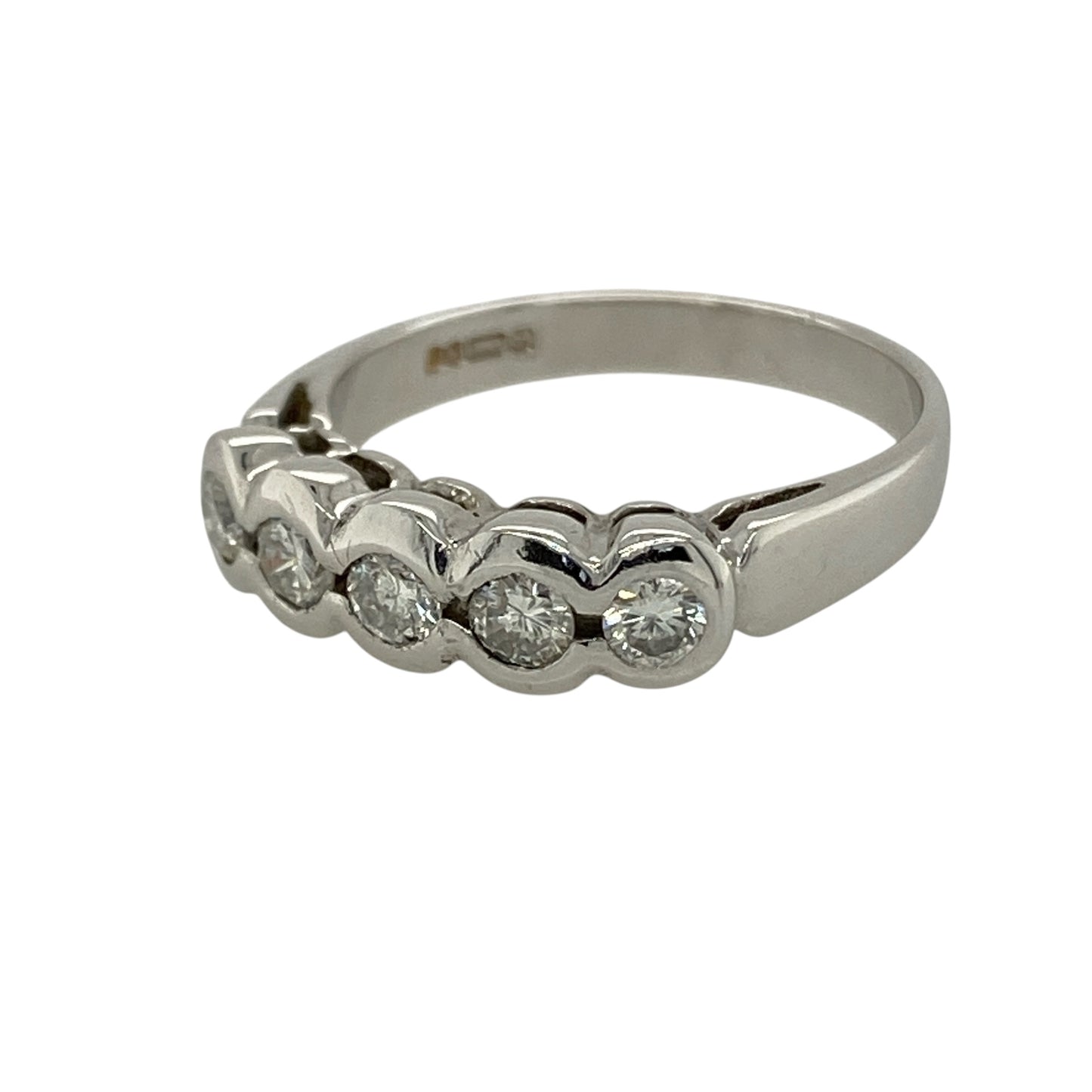 Bring modern elegance and smooth, refined sparkle to your collection with this pre-owned 9ct white gold diamond rubover set five stone band ring, featuring a sleek design with timeless appeal—perfect for everyday wear or special occasions.

Design: The ring features five diamonds arranged across the front in a rubover style, with a band width of approximately 5mm, creating a clean and contemporary look with balanced sparkle.