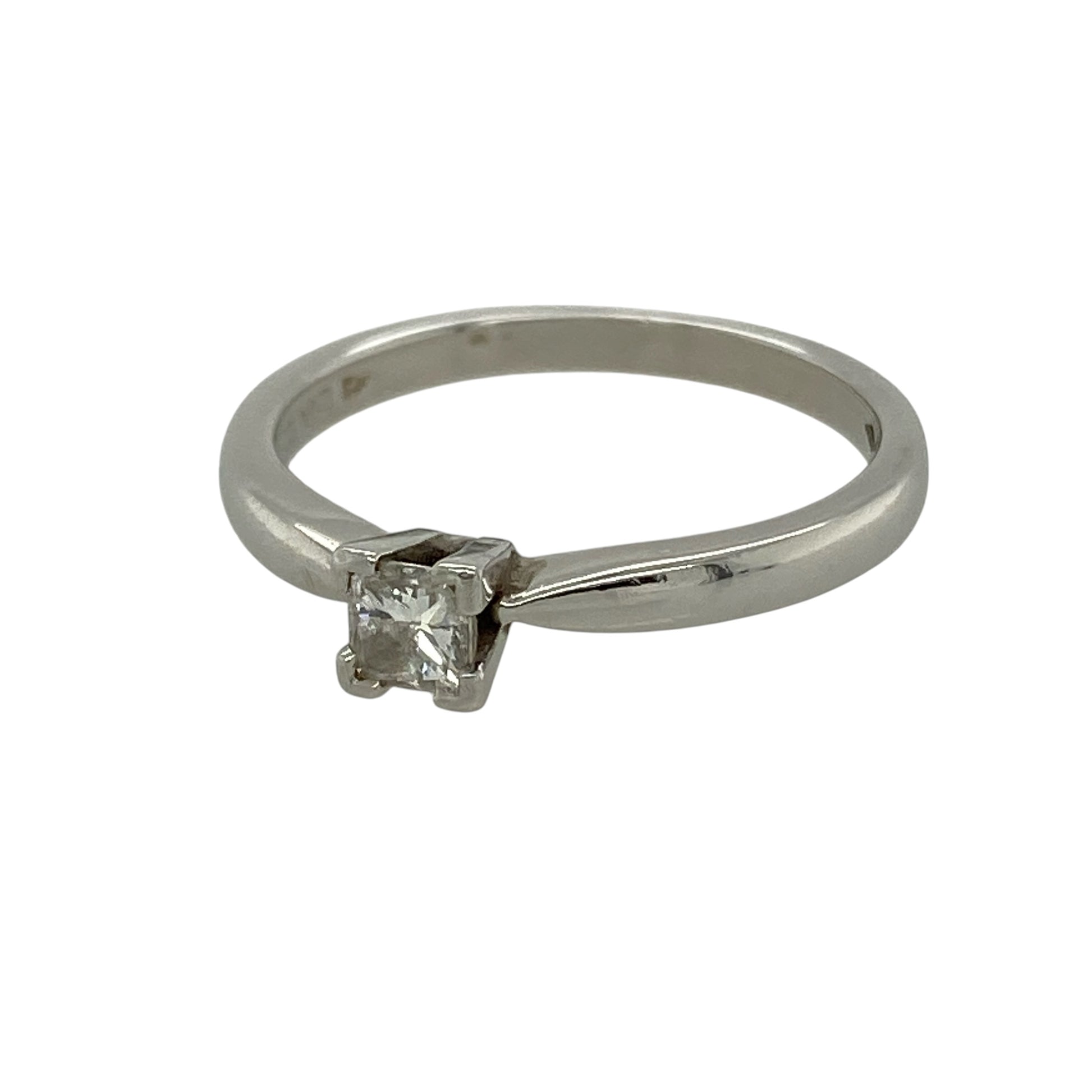 Bring sleek elegance and timeless sparkle to your collection with this pre-owned platinum diamond solitaire ring, featuring a contemporary cut and refined finish—perfect for special occasions or everyday luxury.

Design: The ring showcases a princess-cut diamond of approximately 0.25ct at the centre, offering clean lines and a modern square silhouette within a classic solitaire style.