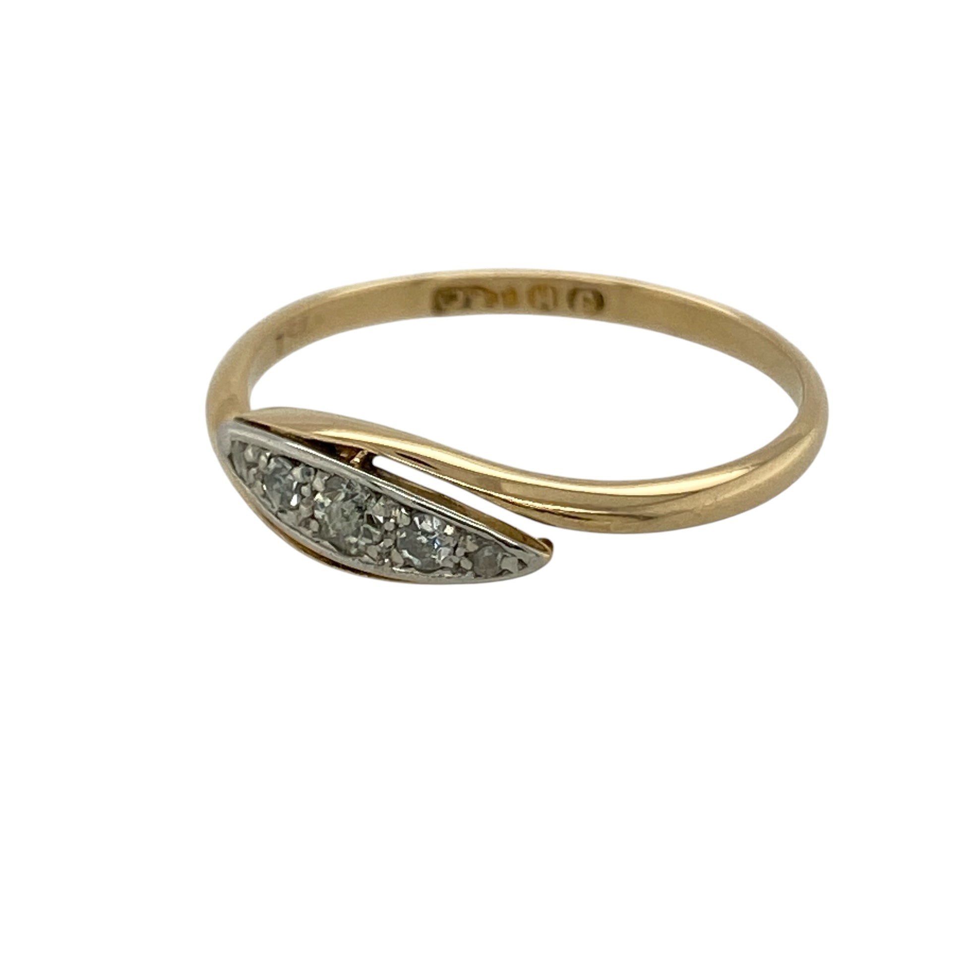 Bring elegant contrast and refined sparkle to your collection with this pre-owned 18ct yellow and white gold diamond wrap over ring, featuring a stylish two-tone design and timeless appeal—perfect for everyday wear or special occasions.

Design: The ring features a wrap over style with a front width of approximately 5mm, set with five diamonds across the centre, creating a balanced and eye-catching look.