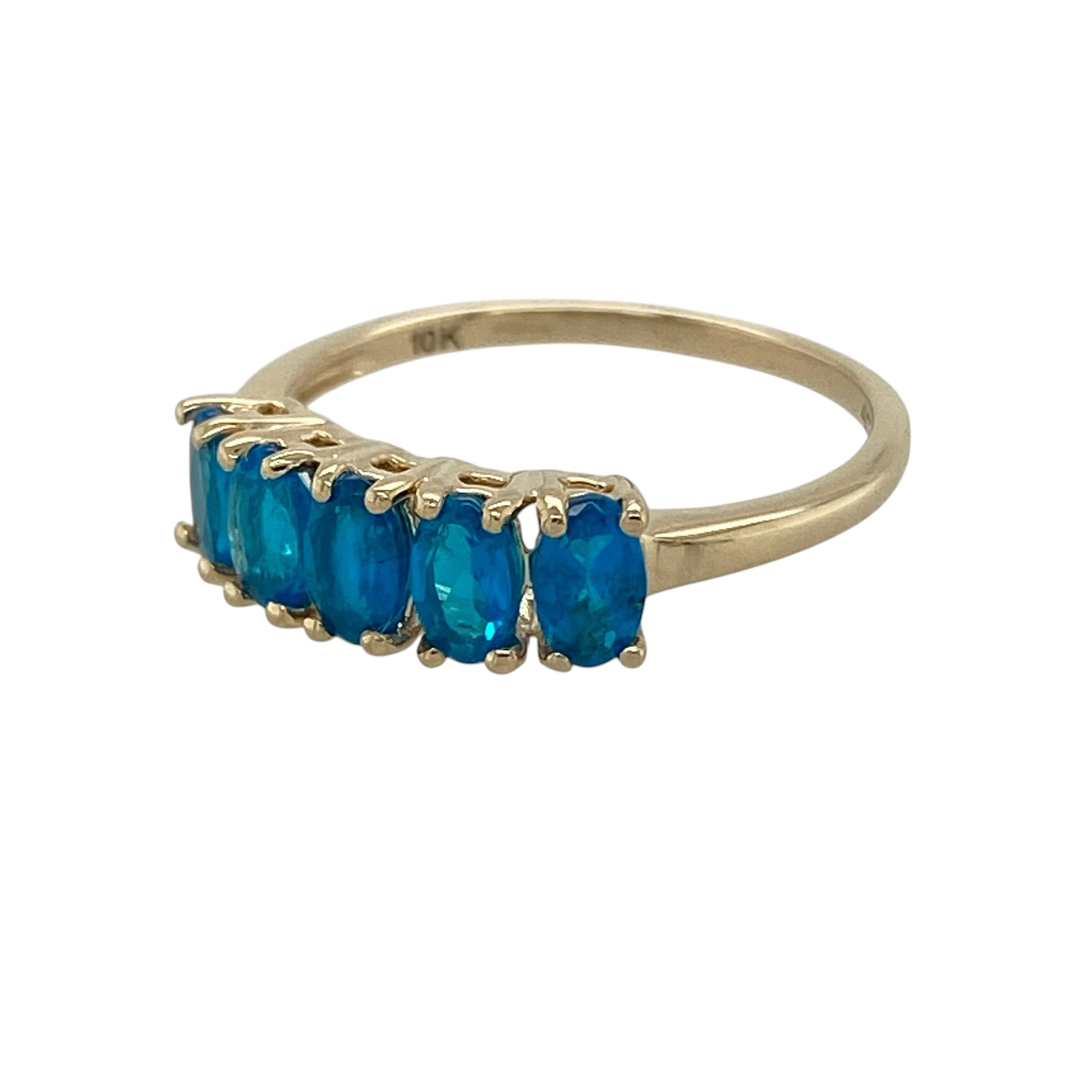 Bring vibrant colour and classic elegance to your collection with this pre-owned 9ct yellow gold blue stone set band ring, featuring a refined row of gemstones—perfect for everyday wear or special occasions.

Design: The ring features five oval blue stones, each measuring approximately 5mm by 3mm, arranged across the band to create a balanced and eye-catching look.