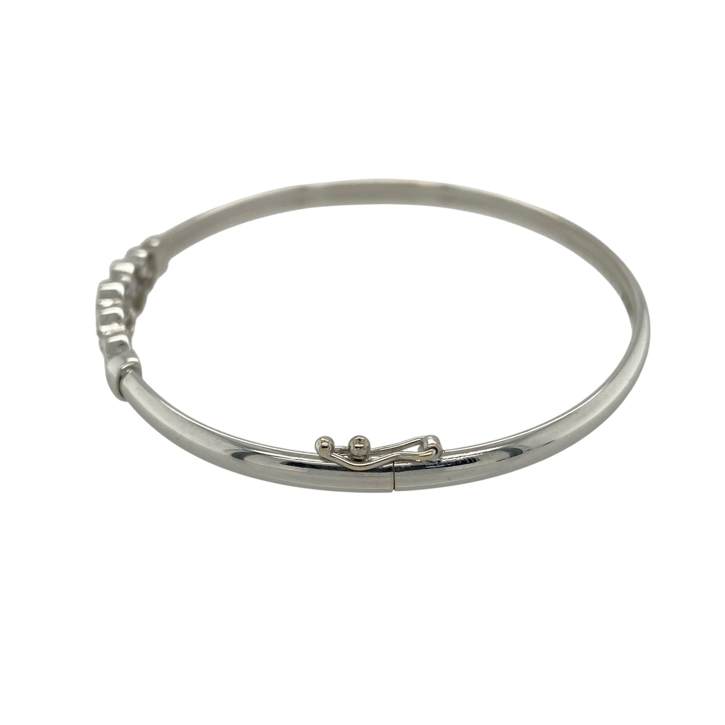 Bring contemporary sparkle and playful design to your collection with this pre-owned 9ct white gold cubic zirconia rubover set bubble style bangle, featuring a modern look with eye-catching detail—perfect for everyday wear or special occasions.

Design: The bangle features a bubble-style front measuring approximately 6mm in height, set with cubic zirconia in a smooth rubover design, creating a sleek and modern appearance with subtle sparkle.