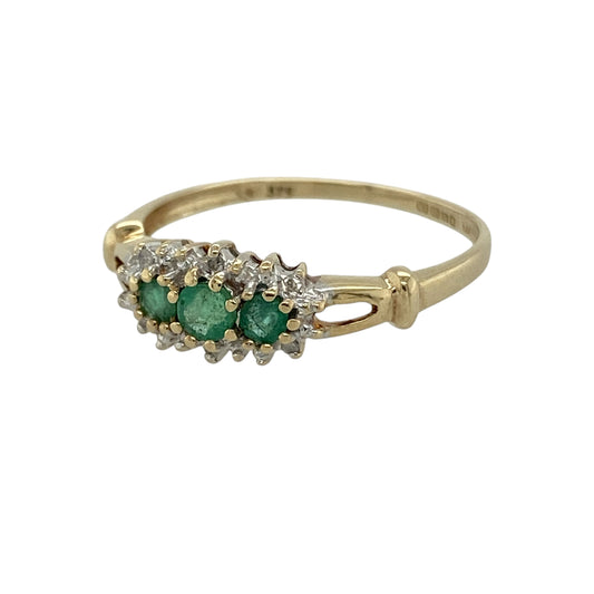 Bring vibrant colour and delicate sparkle to your collection with this pre-owned 9ct yellow gold diamond and emerald trilogy cluster ring, featuring a refined design with timeless appeal—perfect for everyday wear or a meaningful gift.

Design: The ring showcases a 3mm round emerald at the centre, flanked by a smaller emerald on each side, all surrounded by sparkling diamonds to create a soft trilogy cluster effect with added brilliance.