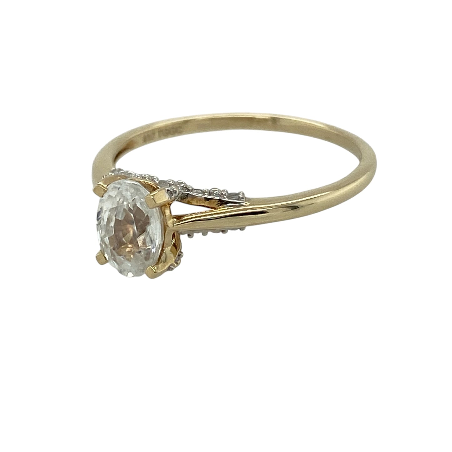 Bring classic sparkle and elegant styling to your collection with this pre-owned 9ct yellow gold cubic zirconia solitaire ring, featuring a striking centre stone with refined detail—perfect for everyday wear or special occasions.

Design: The ring showcases a 7mm by 5mm oval cubic zirconia at the centre, complemented by smaller stones along the band, creating a balanced and eye-catching look.
