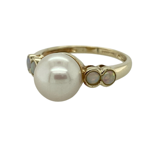 Bring soft lustre and delicate iridescence to your collection with this pre-owned 9ct yellow gold pearl and opalique set ring, featuring a classic centrepiece with elegant accents—perfect for both everyday wear and special occasions.

Design: The ring showcases a 10mm round pearl at the centre, complemented by opalique stones on the shoulders measuring approximately 3mm each, adding subtle shimmer and balance to the design.