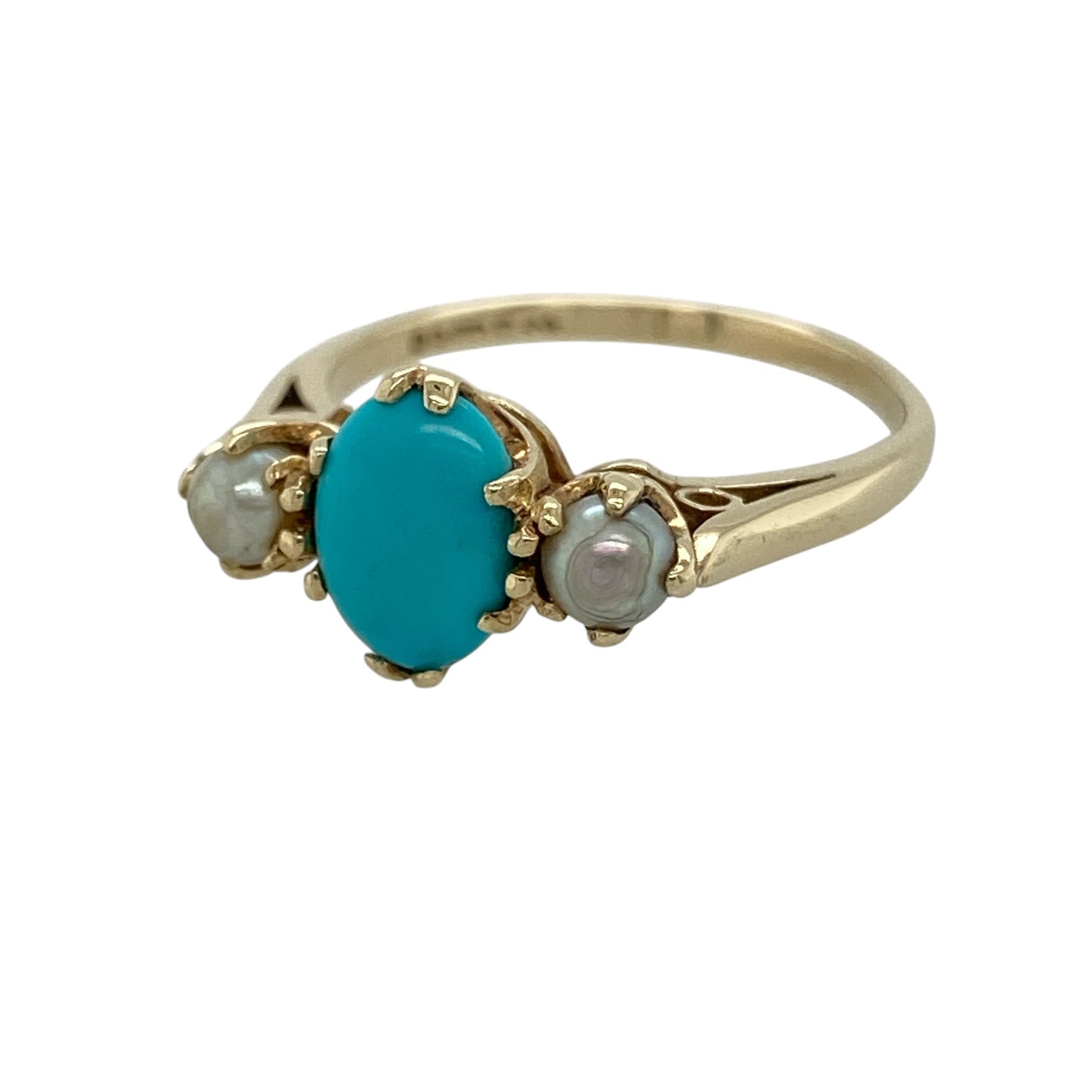 Bring elegant contrast and soft colour to your collection with this pre-owned 9ct yellow gold turquoise and pearl trilogy ring, featuring a distinctive design with timeless appeal—perfect for everyday wear or special occasions.

Design: The ring showcases an 8mm by 6mm oval turquoise-coloured stone at the centre, flanked by two 3mm grey pearls, creating a balanced and eye-catching trilogy arrangement.