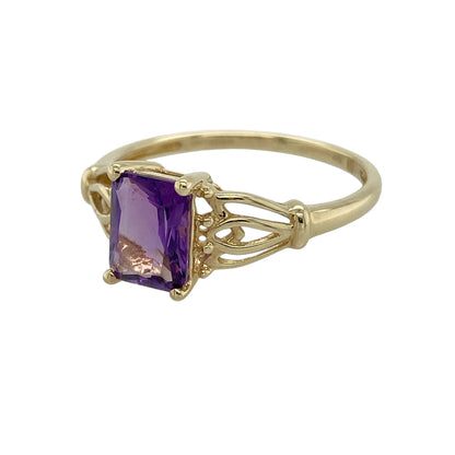 Bring rich colour and elegant detail to your collection with this pre-owned 9ct yellow gold amethyst set ring, featuring a striking centre stone and decorative shoulders—perfect for everyday wear or special occasions.

Design: The ring showcases an 8mm by 6mm rectangular amethyst at the centre, complemented by open patterned shoulders that add texture and a refined, eye-catching finish.