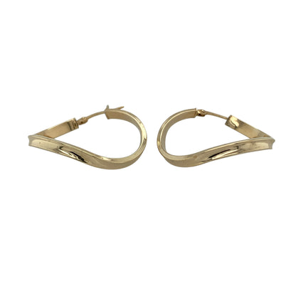 Bring elegant movement and modern style to your collection with these pre-owned 9ct yellow gold wave hoop creole earrings, featuring a flowing design with timeless appeal—perfect for everyday wear or effortless styling.

Design: The earrings feature a wave-shaped hoop creole design measuring approximately 29mm in diameter, creating a soft, flowing silhouette with added visual interest.