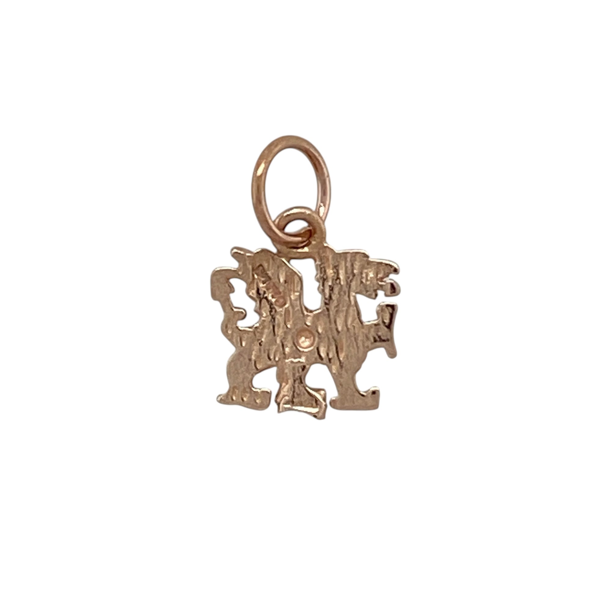 Bring heritage charm and warm tones to your collection with this pre-owned 9ct rose gold Welsh dragon pendant, featuring a symbolic design with timeless appeal—perfect for everyday wear or a meaningful gift.

Design: The pendant showcases a detailed Welsh dragon motif, offering a bold and recognisable design with a classic and eye-catching finish.
Material: Made from 9-carat rose gold, the polished finish enhances the intricate detailing while adding a soft, warm hue for a distinctive look.