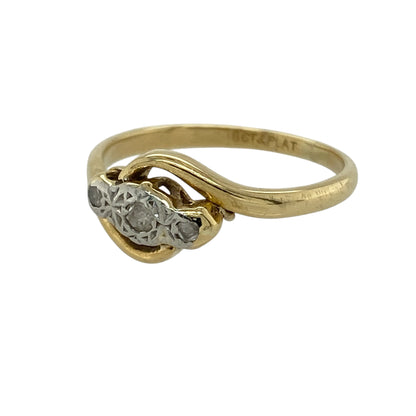 Bring vintage-inspired elegance and timeless sparkle to your collection with this pre-owned 18ct yellow gold and platinum diamond trilogy twist ring, featuring a classic design with refined detail—perfect for special occasions or everyday sophistication.

Design: The ring showcases a trilogy arrangement of diamonds within a graceful twist design, with the front measuring approximately 8mm in height, creating a balanced and eye-catching vintage-style look.