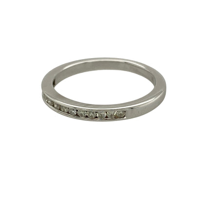 Bring refined sparkle and timeless elegance to your collection with this pre-owned 18ct white gold diamond channel set band ring, featuring a sleek design with classic appeal—perfect for everyday wear or stacking with other rings.

Design: The ring features a slim band style measuring approximately 2mm across the front, set with diamonds in a smooth channel setting for a clean and sophisticated finish.