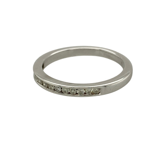 Bring refined sparkle and timeless elegance to your collection with this pre-owned 18ct white gold diamond channel set band ring, featuring a sleek design with classic appeal—perfect for everyday wear or stacking with other rings.

Design: The ring features a slim band style measuring approximately 2mm across the front, set with diamonds in a smooth channel setting for a clean and sophisticated finish.