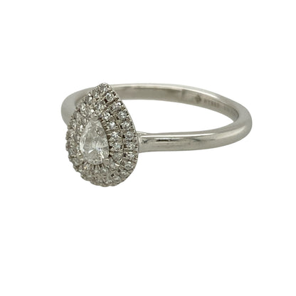 Bring elegant sparkle and luxurious styling to your collection with this pre-owned platinum diamond teardrop double halo ring, featuring a refined design with exceptional brilliance—perfect for special occasions or standout everyday wear.

Design: The ring showcases a teardrop-shaped centre surrounded by a striking double halo of diamonds, with the front measuring approximately 11mm in height for a bold and eye-catching appearance.