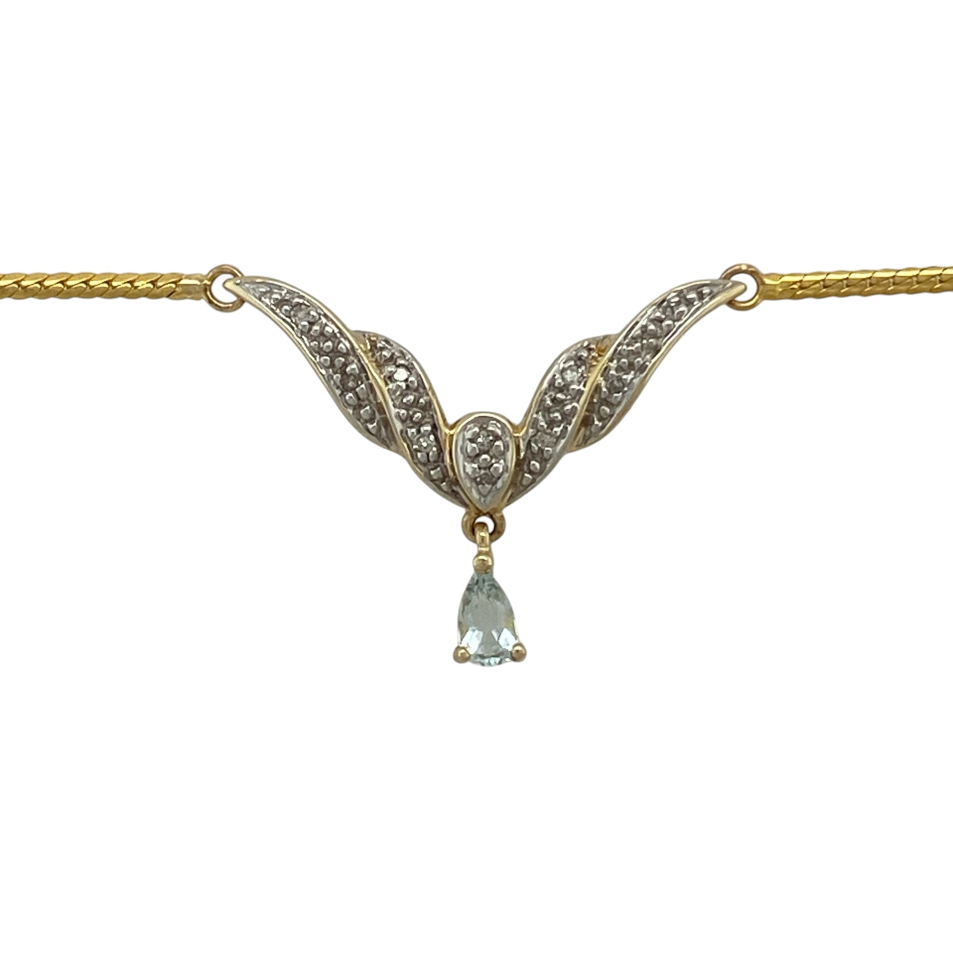 Bring elegant colour and graceful styling to your collection with this pre-owned 9ct yellow and white gold diamond and aquamarine-coloured blue stone necklace, featuring a sophisticated Y-shaped design with delicate sparkle—perfect for special occasions or refined everyday wear.

Design: The necklace features a Y-shaped drop design set with sparkling diamonds and a teardrop-shaped aquamarine-coloured blue stone measuring approximately 5mm by 3mm, creating a graceful and eye-catching focal point.