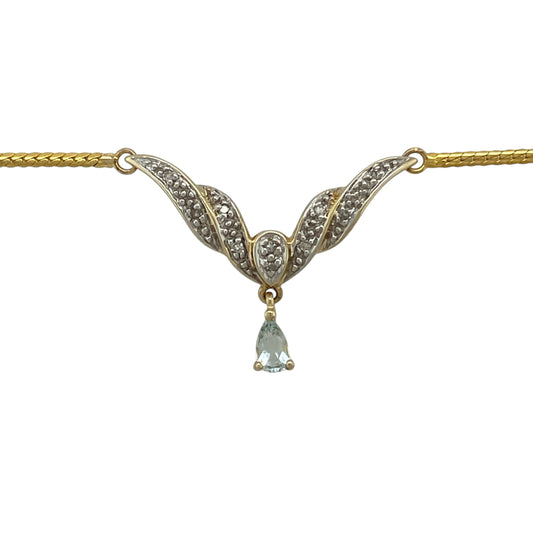 Bring elegant colour and graceful styling to your collection with this pre-owned 9ct yellow and white gold diamond and aquamarine-coloured blue stone necklace, featuring a sophisticated Y-shaped design with delicate sparkle—perfect for special occasions or refined everyday wear.

Design: The necklace features a Y-shaped drop design set with sparkling diamonds and a teardrop-shaped aquamarine-coloured blue stone measuring approximately 5mm by 3mm, creating a graceful and eye-catching focal point.