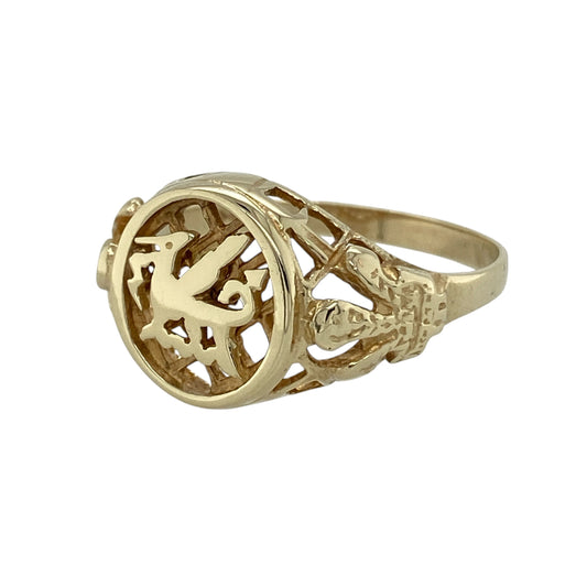 Bring heritage character and bold style to your collection with this pre-owned 9ct yellow gold Welsh dragon signet ring, featuring symbolic detailing with timeless appeal—perfect for everyday wear or a standout statement piece.

Design: The ring showcases a signet-style front measuring approximately 13mm in height, featuring a detailed Welsh dragon motif with open Three Feathers symbol shoulders for added heritage-inspired detail.