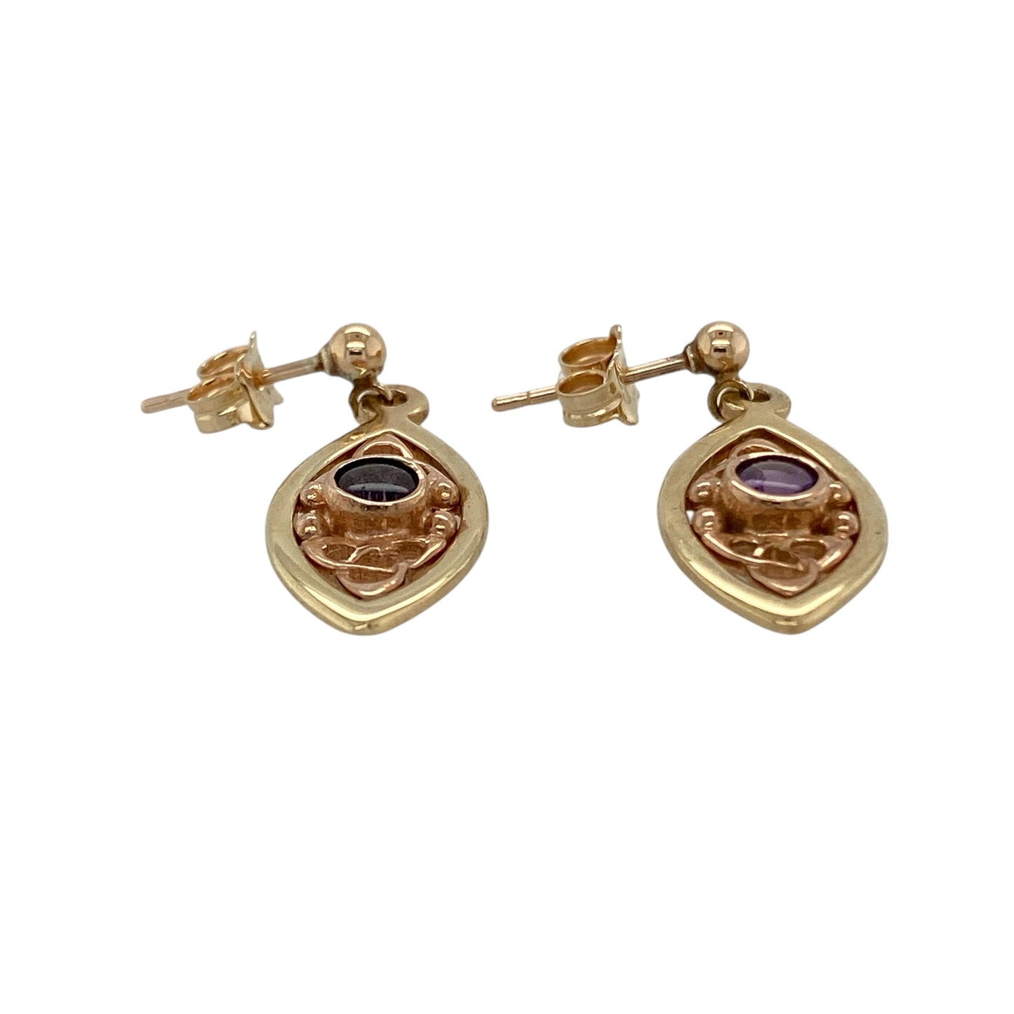 Bring elegant symbolism and rich colour to your collection with these pre-owned 9ct yellow and rose gold Clogau Celtic knot drop earrings, featuring graceful detailing with timeless appeal—perfect for everyday wear or special occasions.

Design: The earrings feature a Celtic knot drop design accented with round amethyst stones measuring approximately 4mm each, creating a flowing and eye-catching look with gentle movement.
