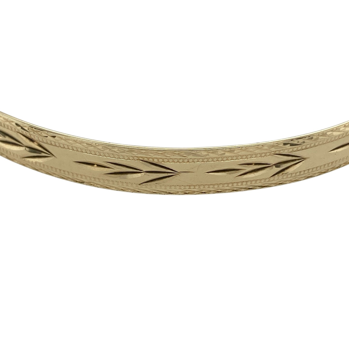 Bring timeless elegance and substantial style to your collection with this pre-owned 9ct yellow solid gold patterned bangle, featuring a classic design with intricate detail—perfect for everyday wear or special occasions.

Design: The bangle features a patterned finish across a 6mm wide profile, creating a decorative and light-catching look with timeless appeal.