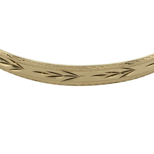 Bring timeless elegance and substantial style to your collection with this pre-owned 9ct yellow solid gold patterned bangle, featuring a classic design with intricate detail—perfect for everyday wear or special occasions.

Design: The bangle features a patterned finish across a 6mm wide profile, creating a decorative and light-catching look with timeless appeal.