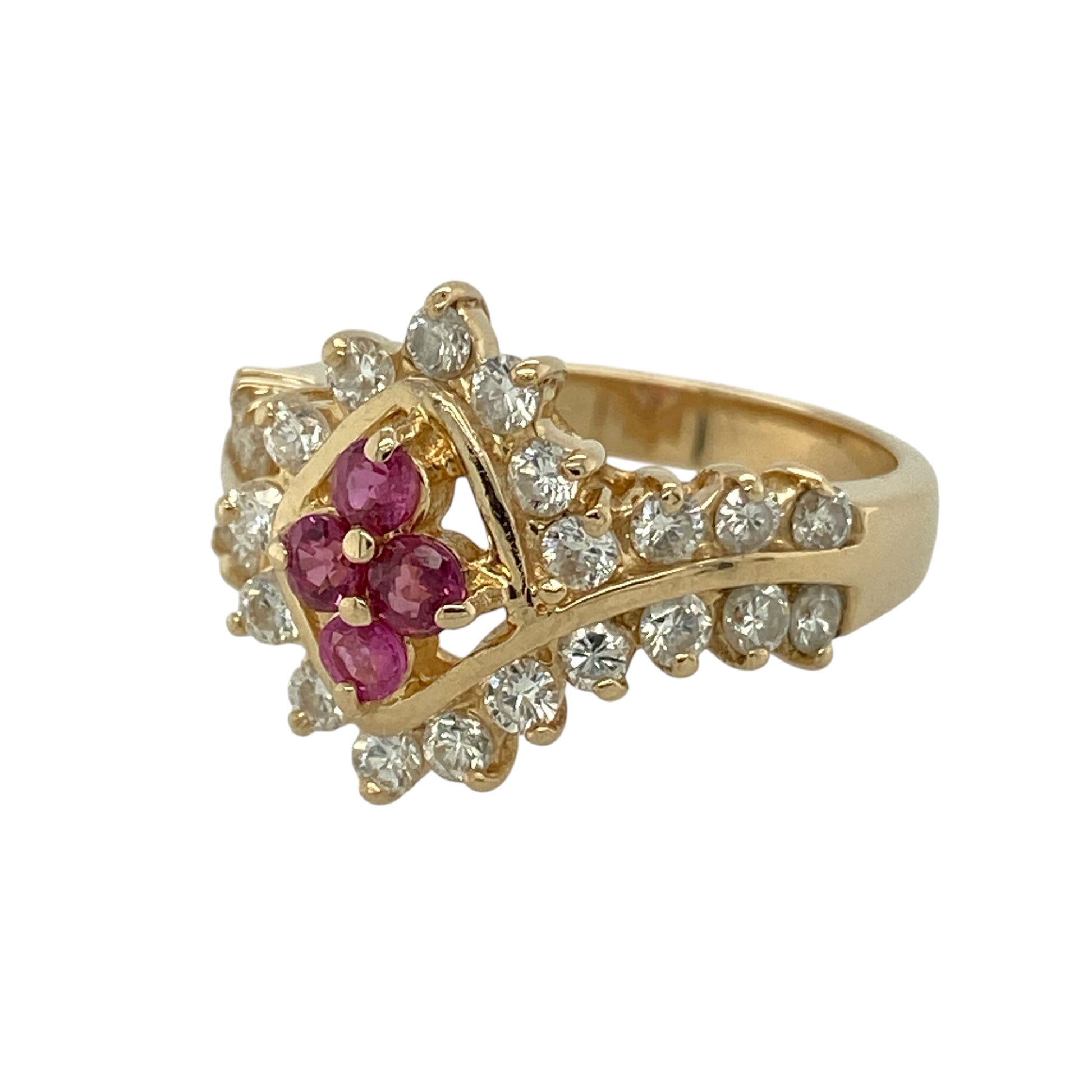 Bring luxurious sparkle and rich colour to your collection with this pre-owned 14ct yellow gold diamond and ruby cluster dress ring, featuring a bold design with elegant detail—perfect for special occasions or standout evening wear.

Design: The ring showcases a dramatic cluster front measuring approximately 15mm in height, formed from four rubies arranged in a teardrop shape, surrounded by sparkling diamonds that continue onto the graceful twist-style shoulders.