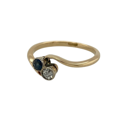 Bring timeless elegance and graceful styling to your collection with this pre-owned 9ct yellow gold diamond and sapphire twist ring, featuring a delicate design with classic appeal—perfect for everyday wear or special occasions.

Design: The ring showcases a 3mm round sapphire within a flowing twist design, accented with sparkling diamonds that add subtle brilliance and movement to the piece.