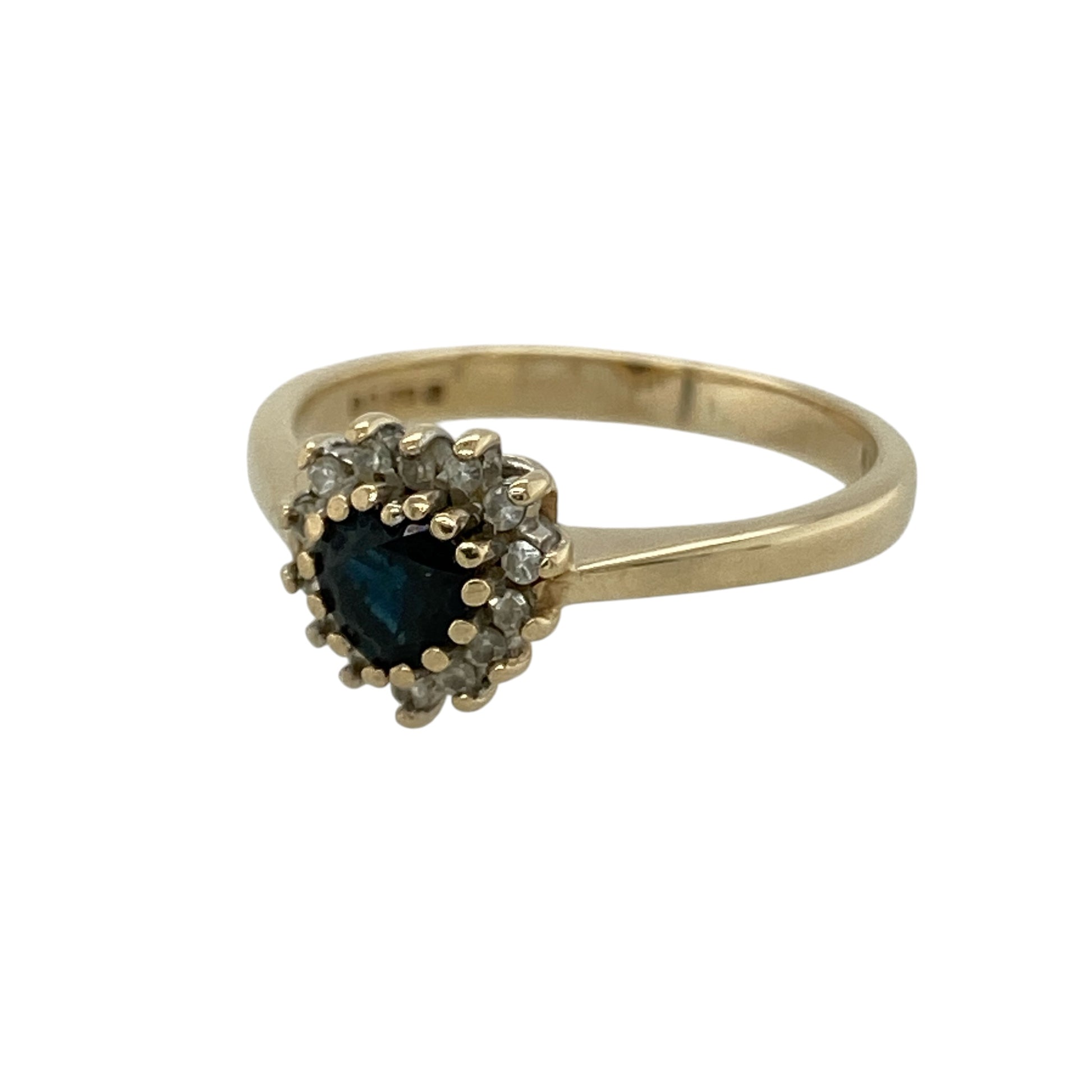 Bring romantic charm and timeless sparkle to your collection with this pre-owned 9ct yellow gold diamond and sapphire heart cluster ring, featuring a graceful design with elegant detail—perfect for special occasions or a meaningful gift.

Design: The ring showcases a heart-shaped sapphire measuring approximately 4mm at the centre, surrounded by sparkling diamonds in a classic cluster arrangement that creates a bright and eye-catching finish.
