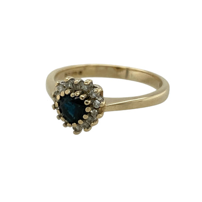 Bring romantic charm and timeless sparkle to your collection with this pre-owned 9ct yellow gold diamond and sapphire heart cluster ring, featuring a graceful design with elegant detail—perfect for special occasions or a meaningful gift.

Design: The ring showcases a heart-shaped sapphire measuring approximately 4mm at the centre, surrounded by sparkling diamonds in a classic cluster arrangement that creates a bright and eye-catching finish.