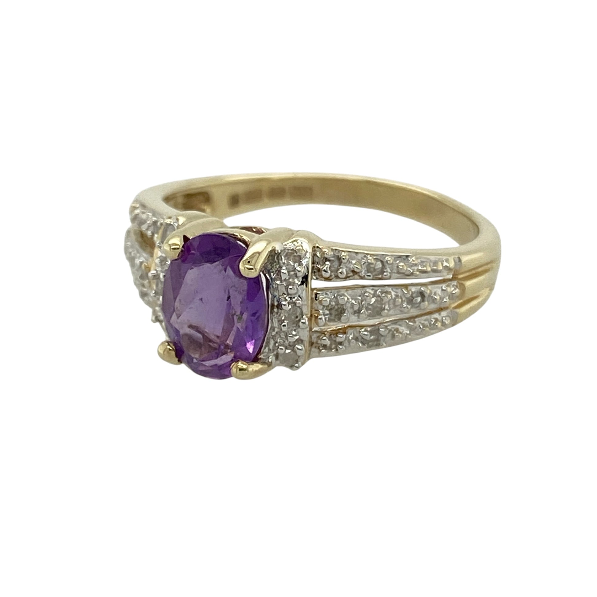 Bring rich colour and elegant sparkle to your collection with this pre-owned 9ct yellow and white gold diamond and amethyst ring, featuring a striking design with refined detail—perfect for special occasions or everyday sophistication.

Design: The ring showcases an 8mm by 6mm oval amethyst at the centre, complemented by diamond-set three-row shoulders that add brilliance and a luxurious finish to the design.