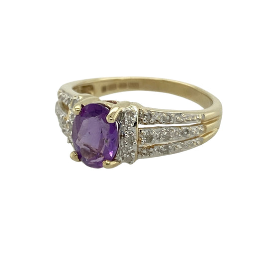 Bring rich colour and elegant sparkle to your collection with this pre-owned 9ct yellow and white gold diamond and amethyst ring, featuring a striking design with refined detail—perfect for special occasions or everyday sophistication.

Design: The ring showcases an 8mm by 6mm oval amethyst at the centre, complemented by diamond-set three-row shoulders that add brilliance and a luxurious finish to the design.